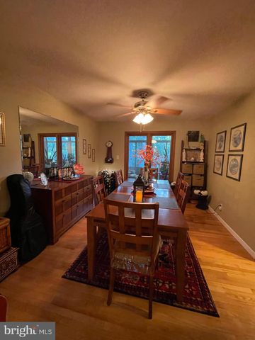 a living room with furniture a rug and a flat screen tv