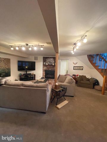 a view of living room with furniture and window