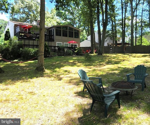 a view of swimming pool with lawn chairs yard and outdoor seating