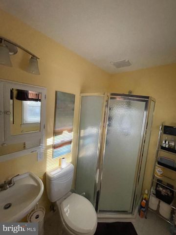 a bathroom with a toilet and a sink