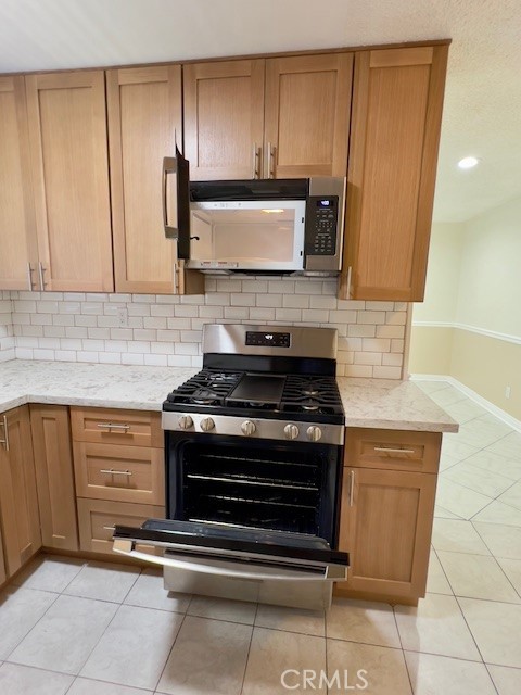 711 North Soldano Avenue, Unit 6 Azusa, CA 91702 - Photo 12 of 41 a stove top oven sitting inside of a kitchen