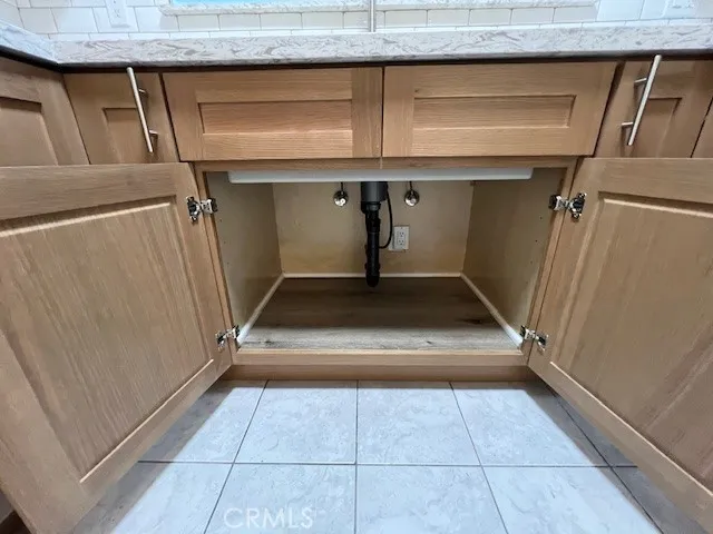 a view of a room with shelves on the wall