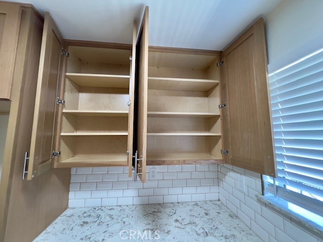 711 North Soldano Avenue, Unit 6 Azusa, CA 91702 - Photo 23 of 41 a view of a room with shelves on the wall