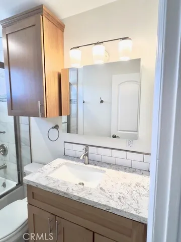 a bathroom with a sink and a toilet