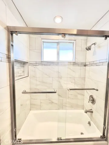 a bathroom with a toilet sink vanity and mirror