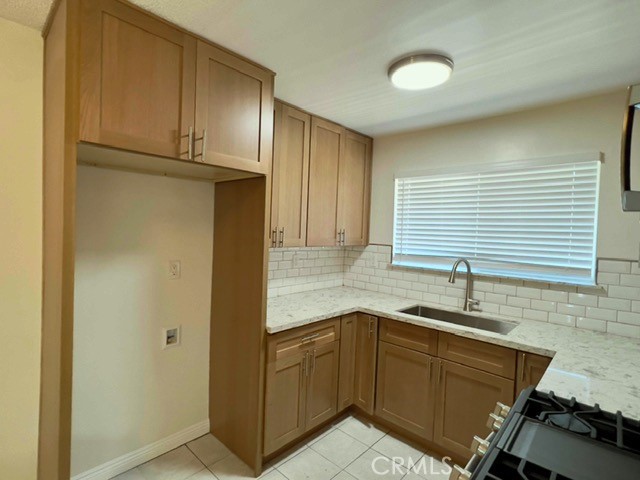 711 North Soldano Avenue, Unit 6 Azusa, CA 91702 - Photo 10 of 41 a kitchen with a sink and cabinets
