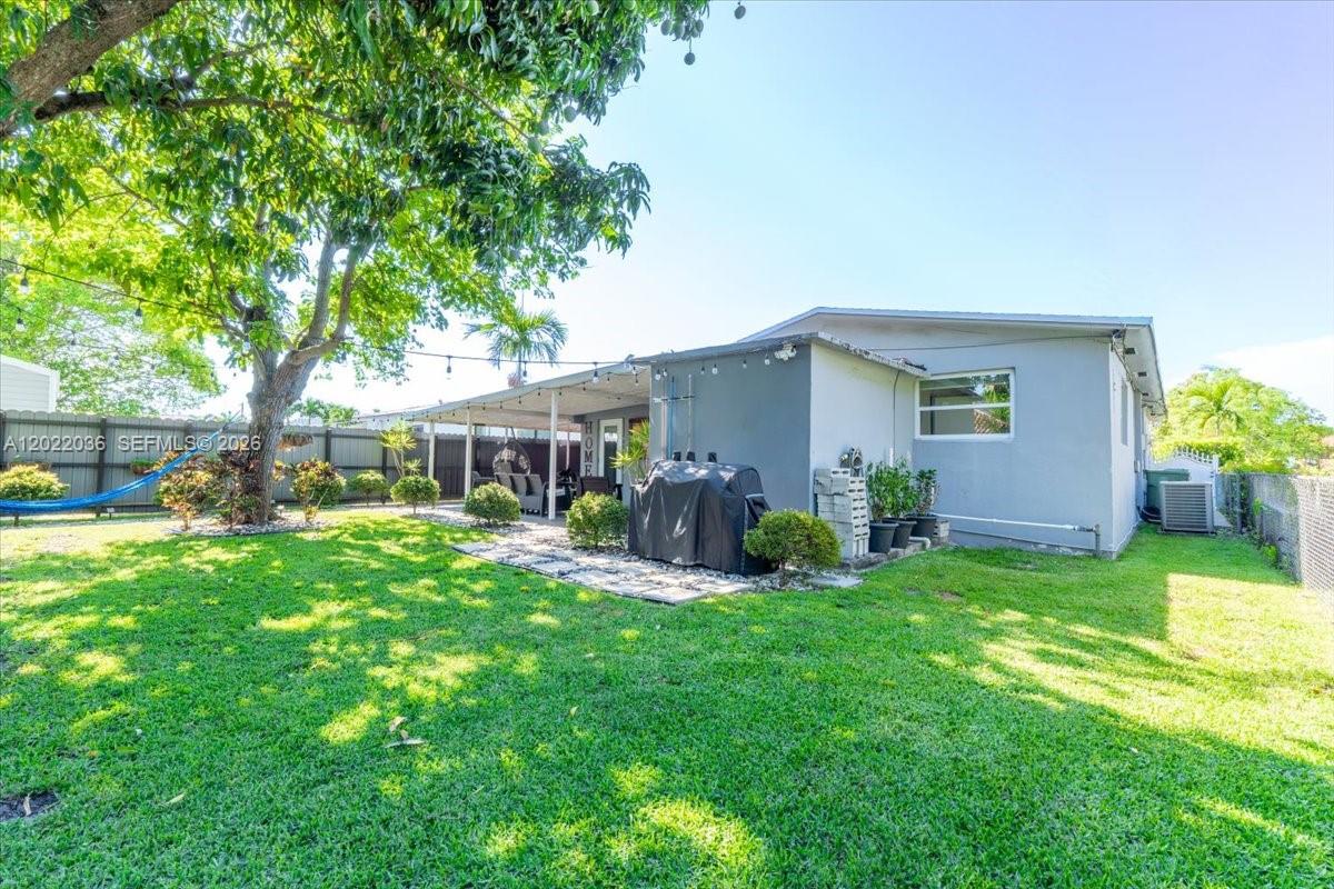 120 West 50th Street Hialeah, FL 33012 - Photo 3 of 22 a view of a house with a yard and sitting area