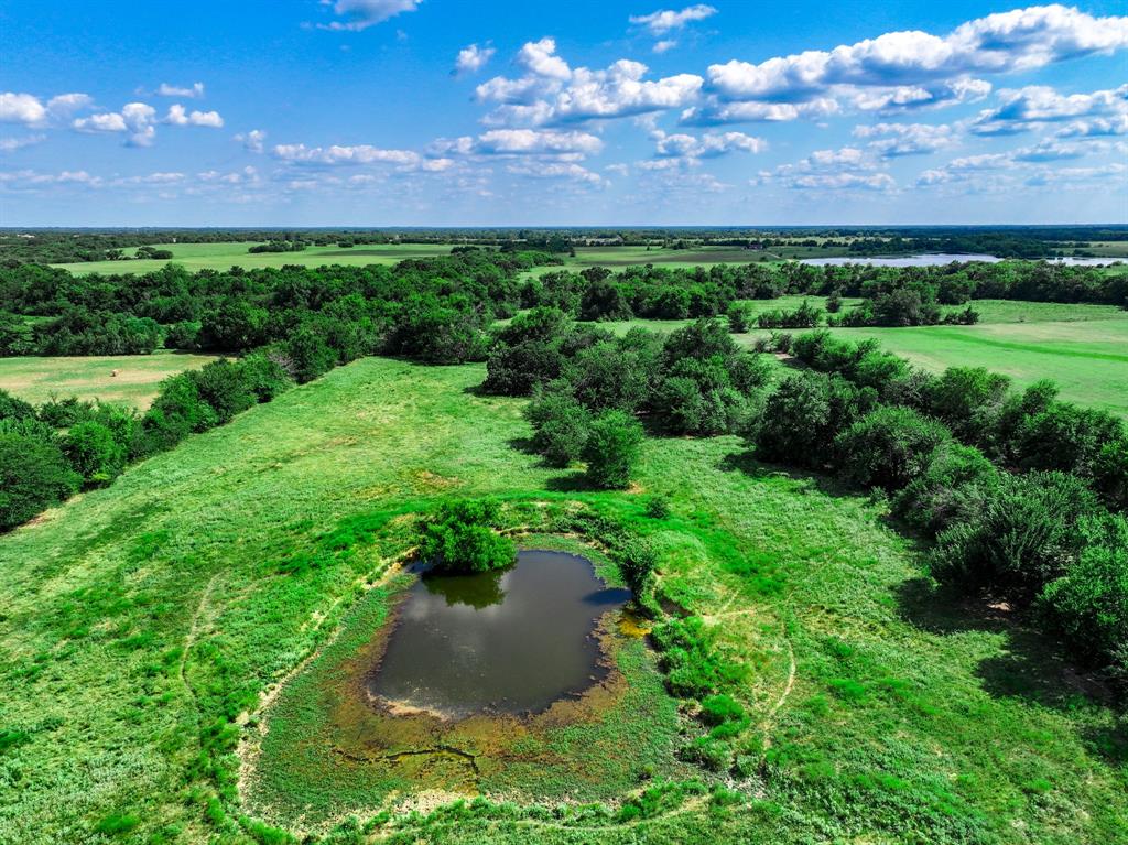7801 West Interstate Highway Cumby, TX 75433 - Photo 13 of 32 a view of a garden with a building