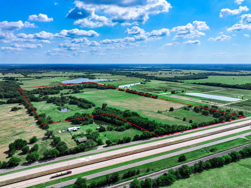 7801 West Interstate Highway Cumby, TX 75433 - Photo 2 of 32 a view of a city with sunset view