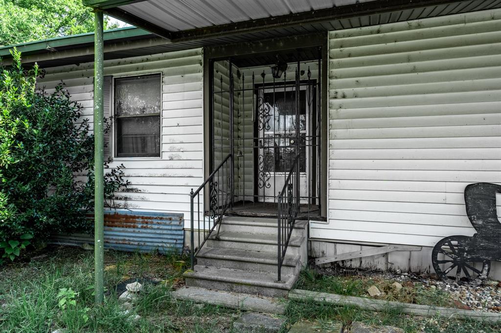 7801 West Interstate Highway Cumby, TX 75433 - Photo 28 of 32 a view of a house with backyard and garden
