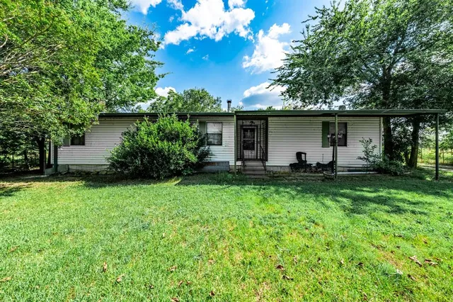 a front view of house with yard