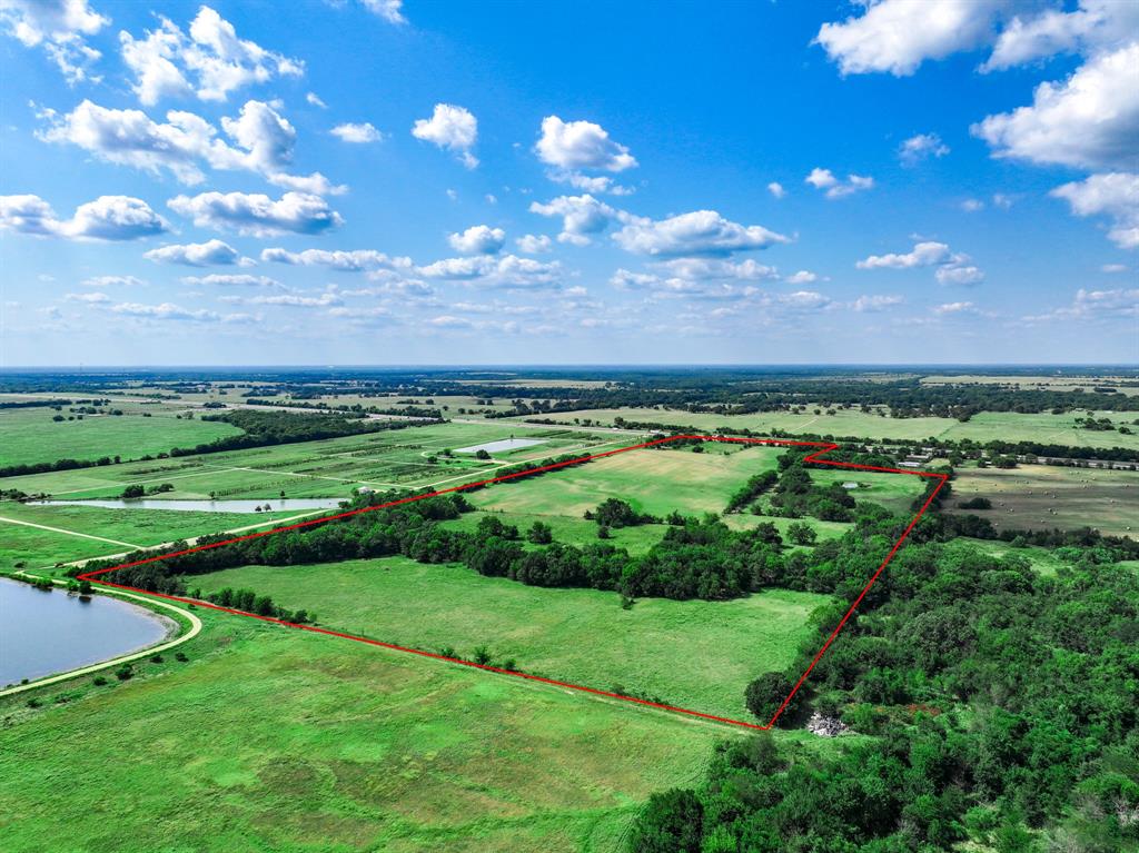 7801 West Interstate Highway Cumby, TX 75433 - Photo 6 of 32 a view of a golf course with a lake