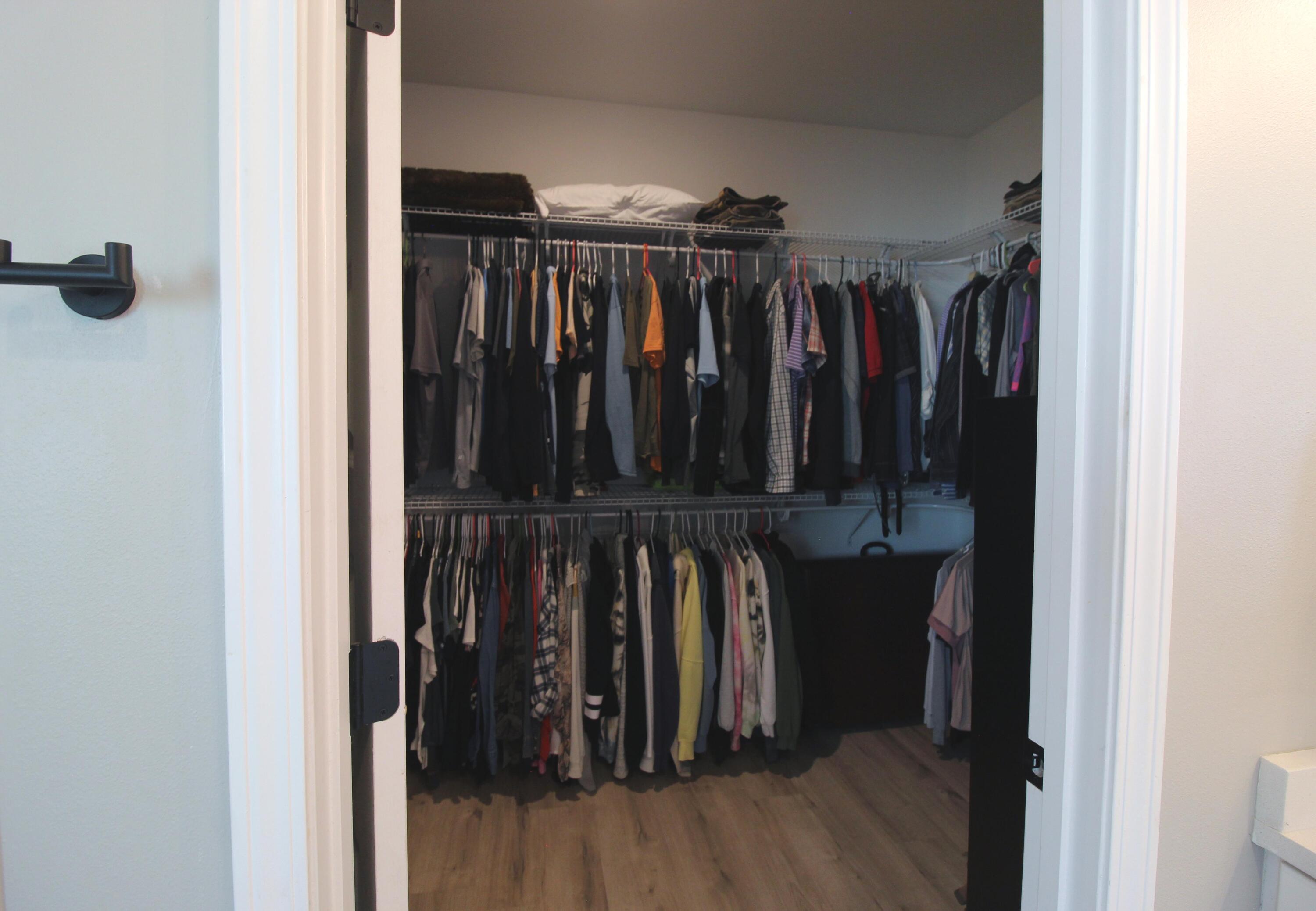 64 Indian Cove Freeport, FL 32439 - Photo 41 of 87 a view of walk in closet with clothes and shoes