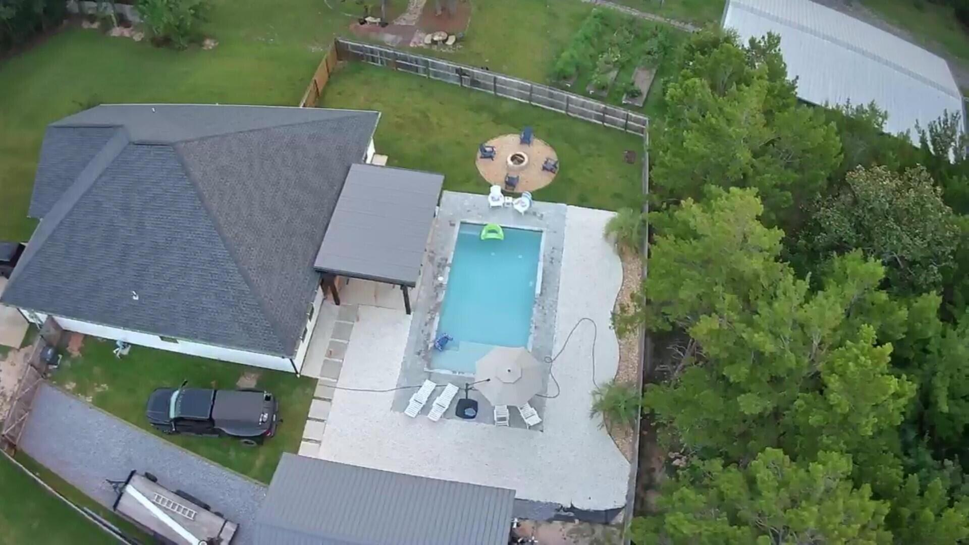64 Indian Cove Freeport, FL 32439 - Photo 5 of 87 an aerial view of a house having yard