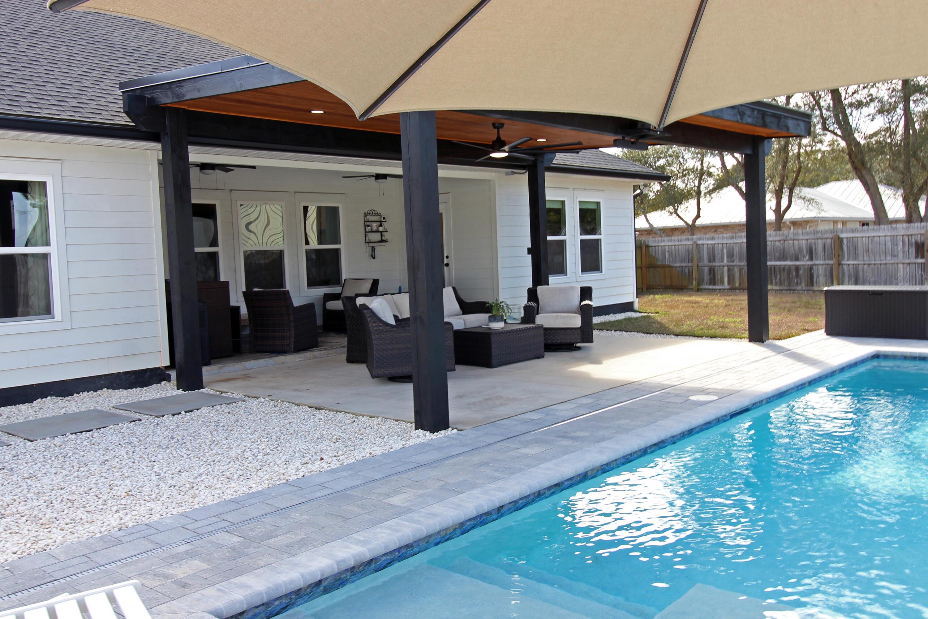 64 Indian Cove Freeport, FL 32439 - Photo 68 of 87 a view of a house with backyard porch and sitting area