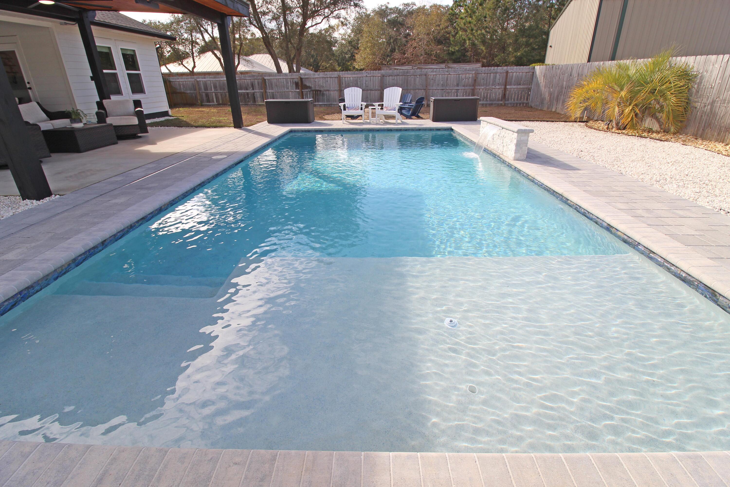 64 Indian Cove Freeport, FL 32439 - Photo 70 of 87 a view of a swimming pool with a patio