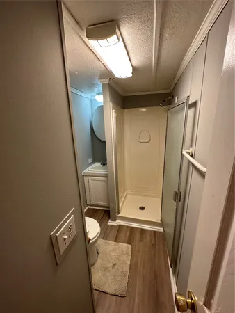 a bathroom with a sink a mirror and a shower