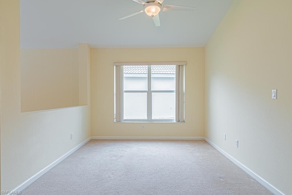 7101 Timberland Circle Naples, FL 34109 - Photo 15 of 50 an empty room with a window