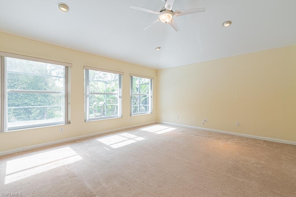 7101 Timberland Circle Naples, FL 34109 - Photo 17 of 50 an empty room with a window