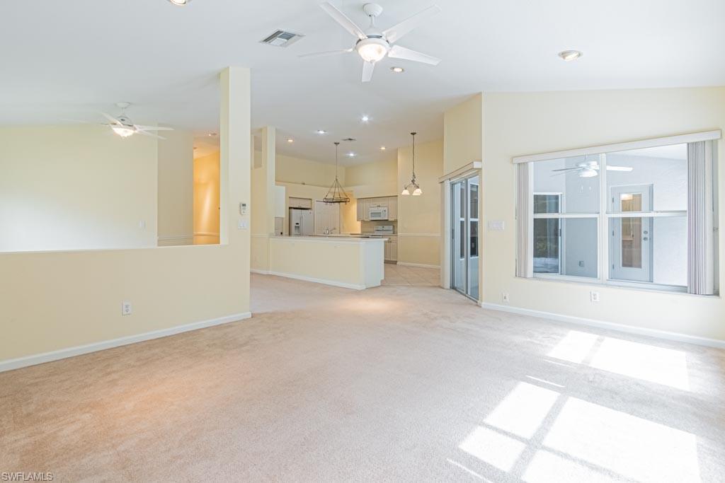 7101 Timberland Circle Naples, FL 34109 - Photo 20 of 50 a view of a kitchen with large windows