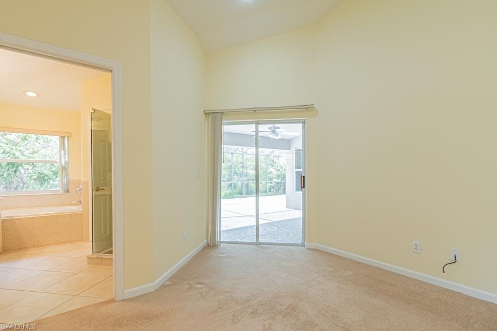 7101 Timberland Circle Naples, FL 34109 - Photo 22 of 50 an empty room with windows