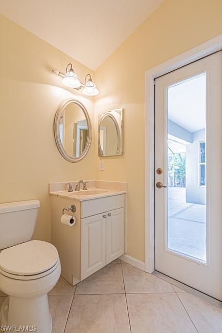 7101 Timberland Circle Naples, FL 34109 - Photo 29 of 50 a bathroom with a granite countertop toilet sink and mirror