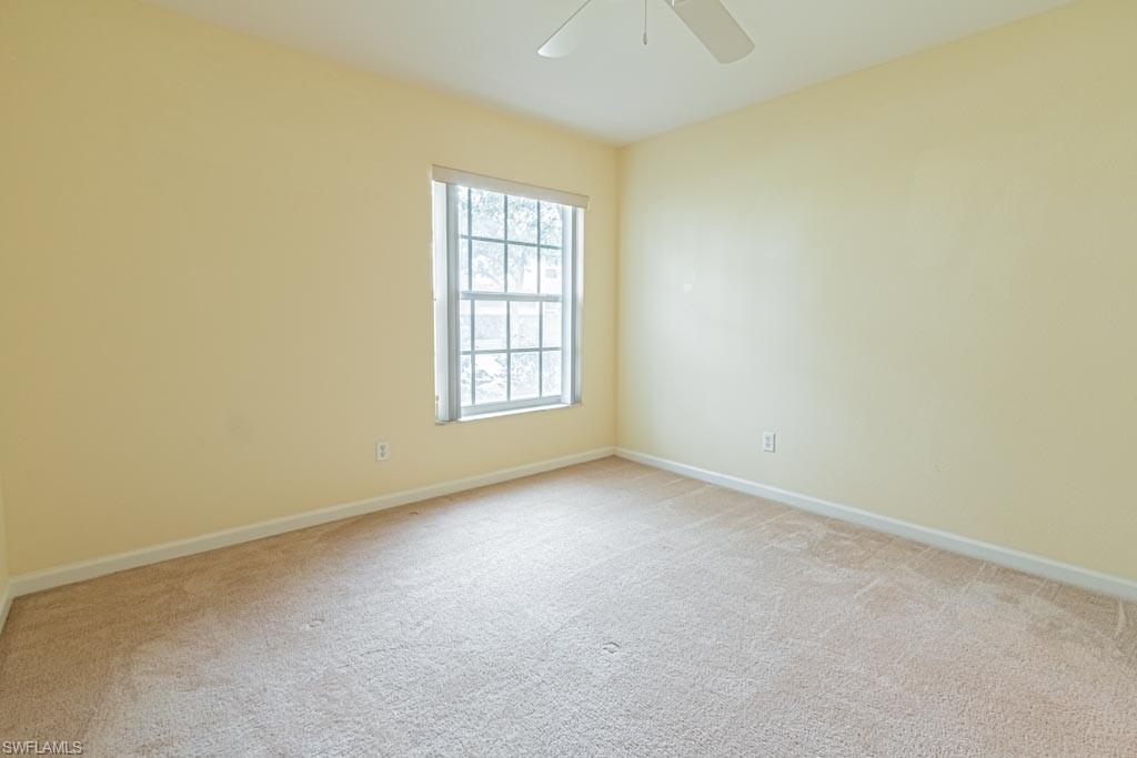 7101 Timberland Circle Naples, FL 34109 - Photo 31 of 50 an empty room with windows