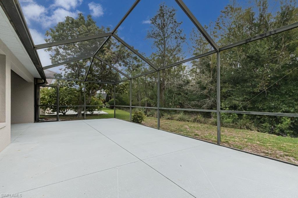 7101 Timberland Circle Naples, FL 34109 - Photo 44 of 50 a view of swimming pool with a yard and sitting area
