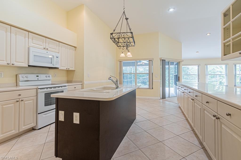 7101 Timberland Circle Naples, FL 34109 - Photo 8 of 50 a kitchen with counter top space and sink