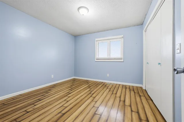 a view of a livingroom with furniture and a flat screen tv