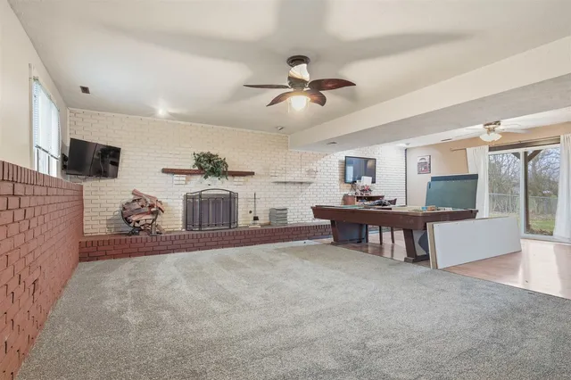 a room with a table chairs and a wooden floor