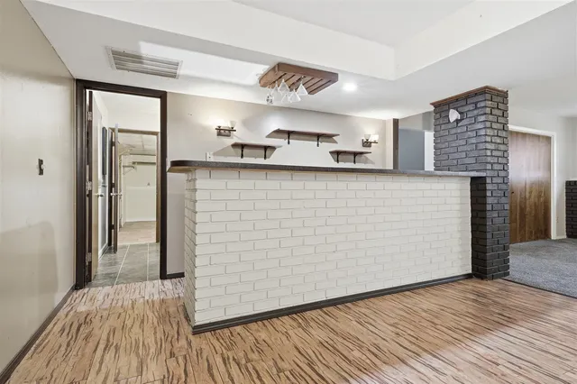 a bathroom with a toilet a sink and a mirror