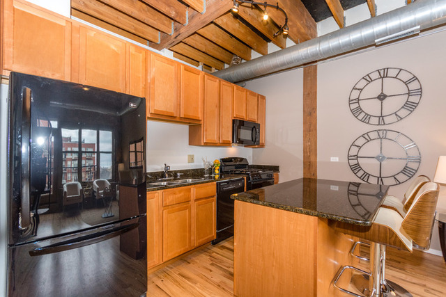 1500 West Monroe Street, Unit 715 Chicago, IL 60607 - Photo 2 of 26 a kitchen with granite countertop lots of counter top space