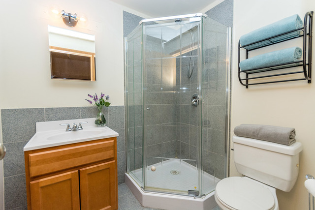 1500 West Monroe Street, Unit 715 Chicago, IL 60607 - Photo 21 of 26 a bathroom with a toilet a sink and a shower