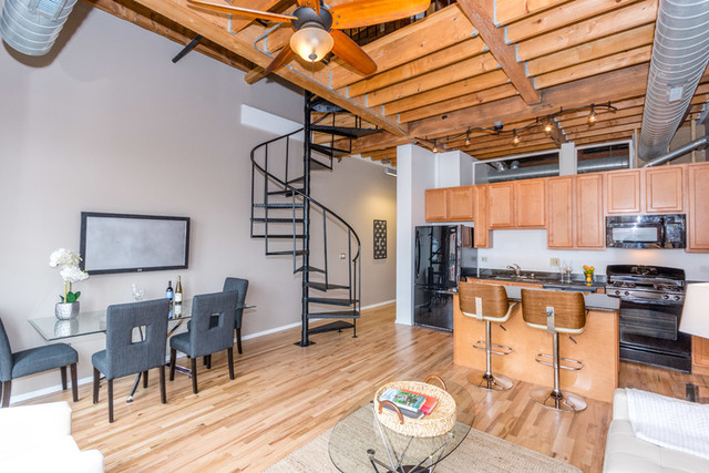 1500 West Monroe Street, Unit 715 Chicago, IL 60607 - Photo 5 of 26 a living room with furniture and wooden floor