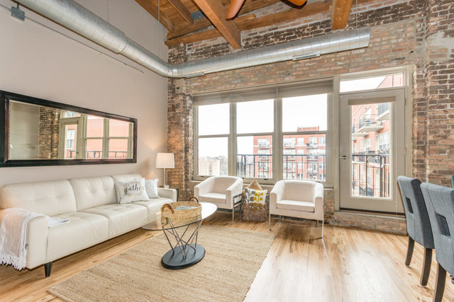 1500 West Monroe Street, Unit 715 Chicago, IL 60607 - Photo 8 of 26 a living room with furniture and a large window