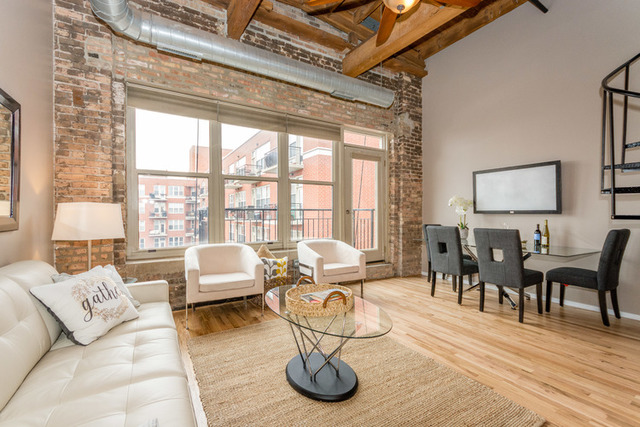 1500 West Monroe Street, Unit 715 Chicago, IL 60607 - Photo 9 of 26 a living room with furniture and a large window