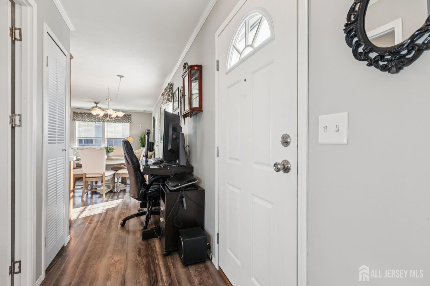 852 Highway 1, Unit X3 Edison, NJ 08817 - Photo 14 of 19 a view of a room with wooden floor mirror and windows