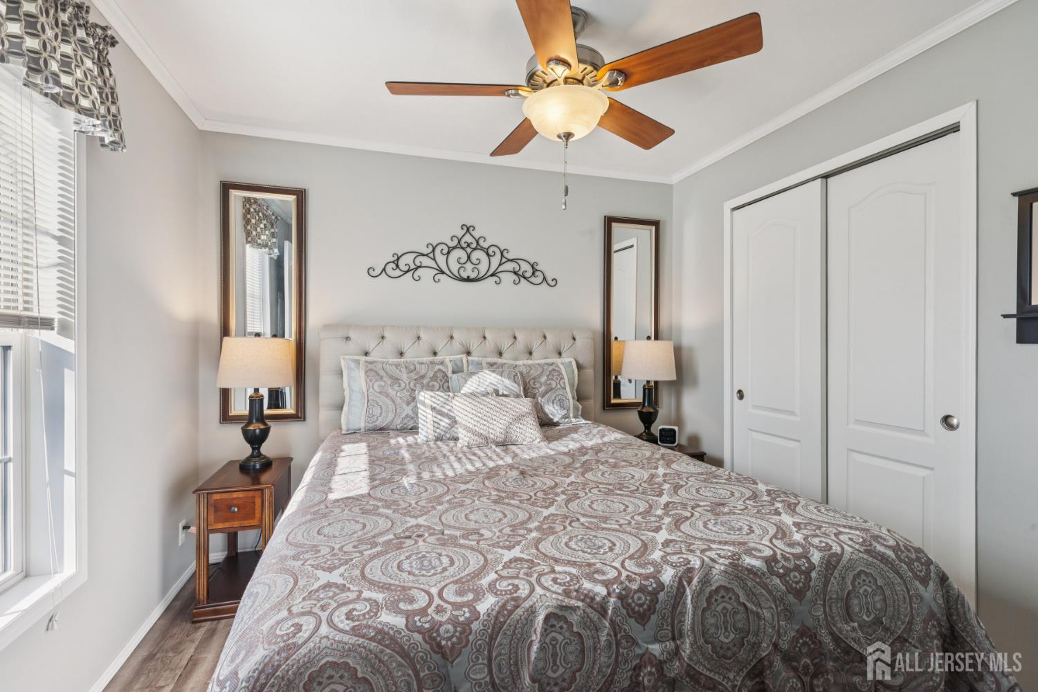 852 Highway 1, Unit X3 Edison, NJ 08817 - Photo 16 of 19 a bedroom with a large bed and a chandelier