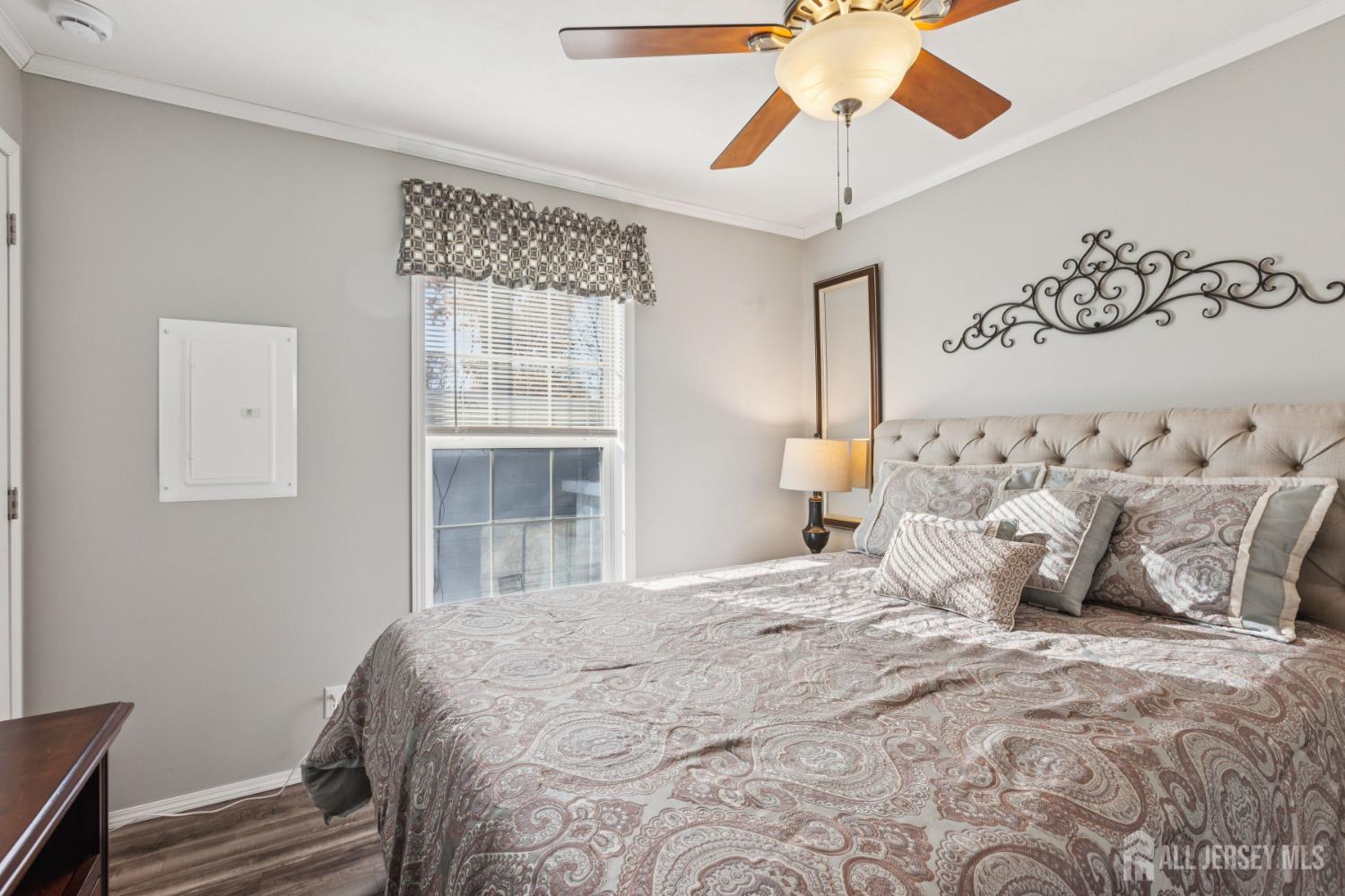 852 Highway 1, Unit X3 Edison, NJ 08817 - Photo 17 of 19 a bedroom with a large bed and a chandelier