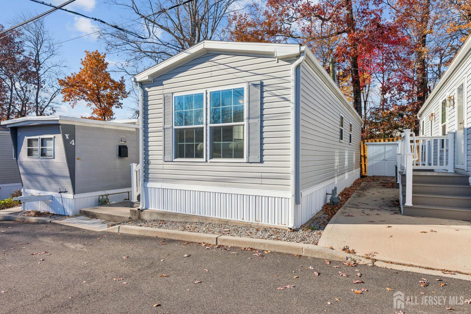 852 Highway 1, Unit X3 Edison, NJ 08817 - Photo 2 of 19 a house with trees in the background