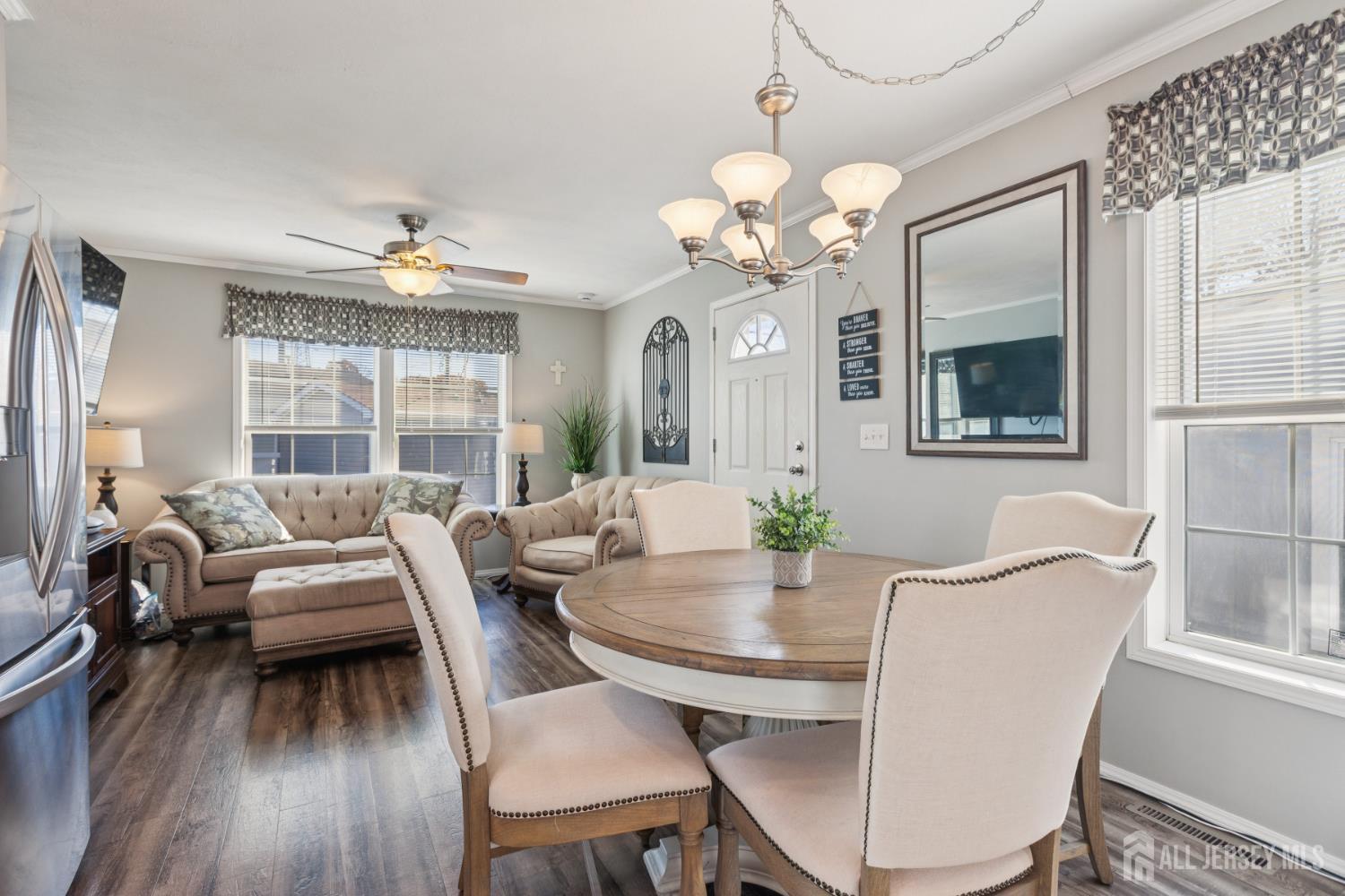852 Highway 1, Unit X3 Edison, NJ 08817 - Photo 6 of 19 a view of a dining room with furniture wooden floor and chandelier