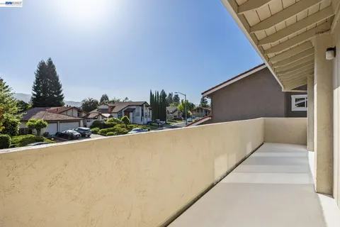 a view of balcony with furniture