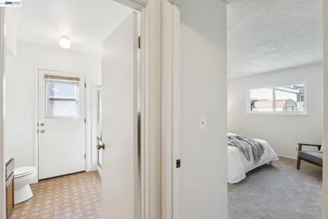 a view of bedroom with wooden floor