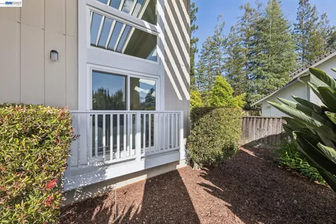 a view of a house with a small yard