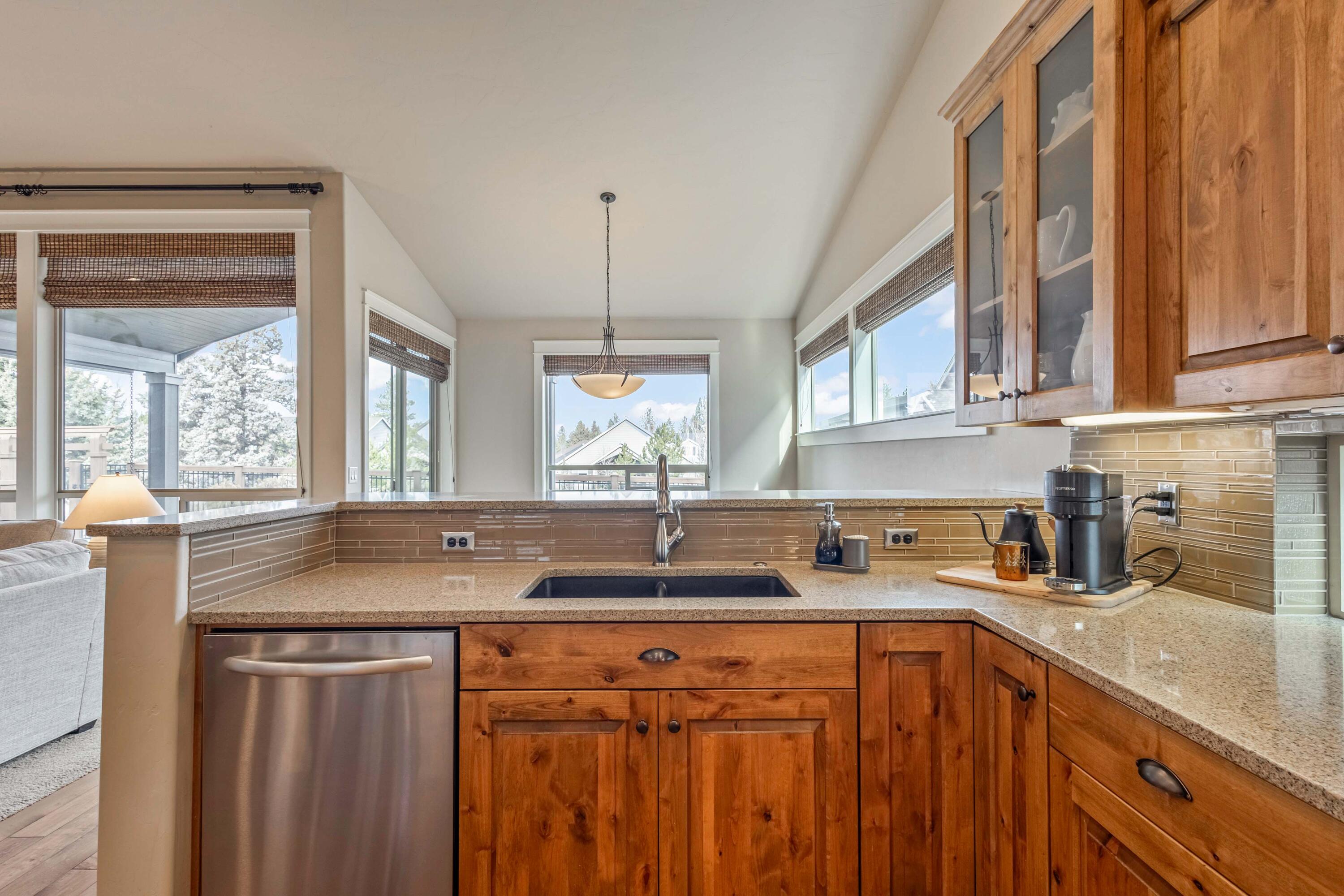 20870 Golden Gate Place Bend, OR 97702 - Photo 9 of 42 Kitchen with large island, solid surface countertops, and stainless steel appliances.