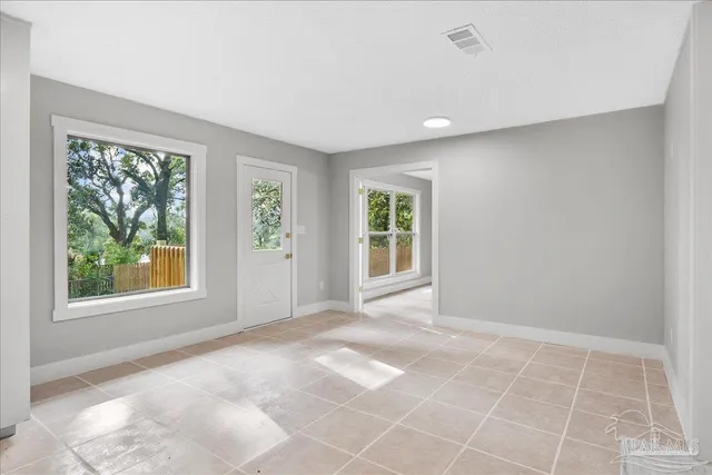 a view of an empty room with a window