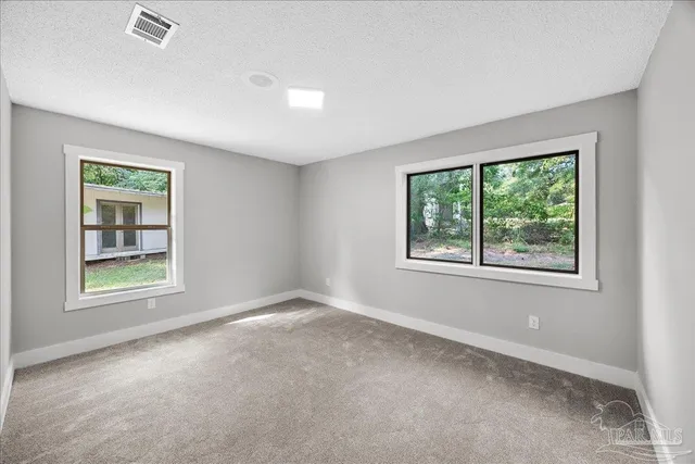 an empty room with windows