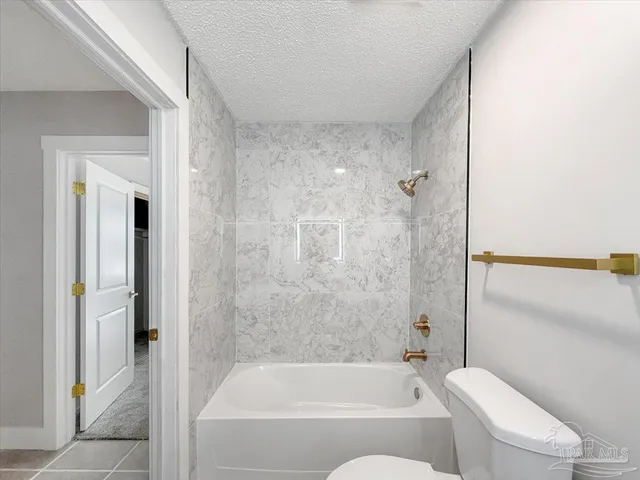 a bathroom with a bathtub and shower