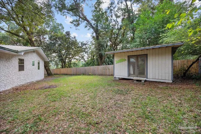 a backyard of a house with lots of green space